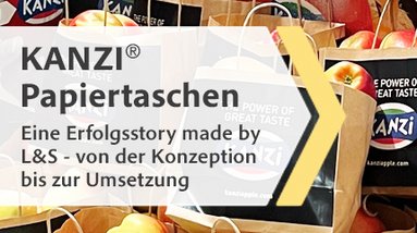 Banner zeigt Papiertaschen von KANZI®, die mit Äpfeln gefüllt sind.